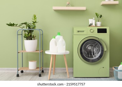 Interior Of Bathroom With Modern Green Washing Machine