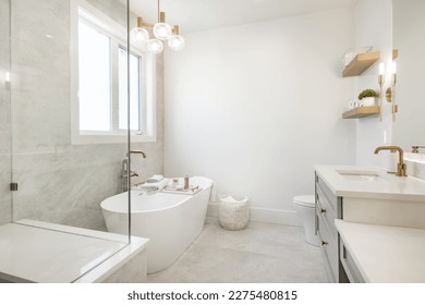 Interior bathroom photography with glass doors subway tile freestanding tub and pedestal sink slate floors granite counter towels claw footed bathtub and view windows  - Shutterstock ID 2275480815