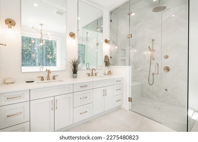 Interior bathroom photography with glass doors subway tile freestanding tub and pedestal sink slate floors granite counter towels claw footed bathtub and view windows 