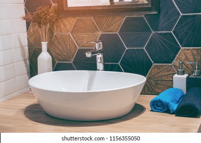 Interior of bathroom with sink basin faucet and mirror. Modern design of bathroom.