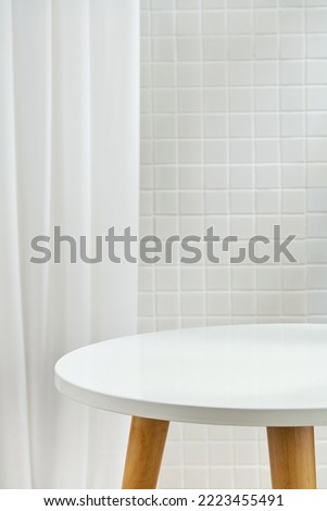 An interior bathroom table with a white mosaic tiles wall. Background for design products.
Wall tiles.