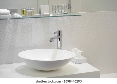 Interior of bathroom with washbasin and faucet. Bathroom interior sink with modern design in luxury hotel.