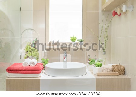 Interior of bathroom with washbasin faucet and white towel.Modern design of bathroom.