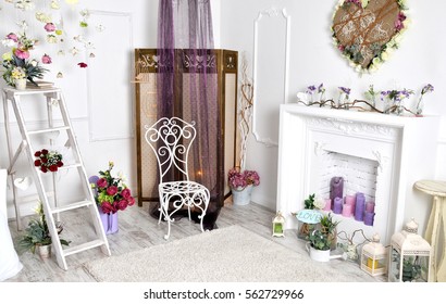 Interior With Beautiful Decorations In Comfortable Living Room, Home Decoration, Interior For Celebration. Shabby Chic Rustic, Armchair, Folding Screen Or Room Divider, Fireplace, Lights, Flowers