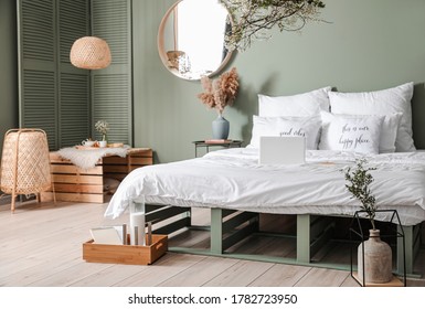 Interior of beautiful modern bedroom with spring flowers - Powered by Shutterstock