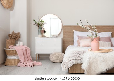 Interior Of Beautiful Modern Bedroom With Spring Flowers