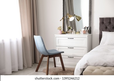 Interior Of Bedroom With Dressing Table Near Wall