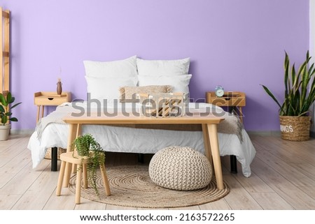 Image, Stock Photo Modern bedroom with purple accents and city view