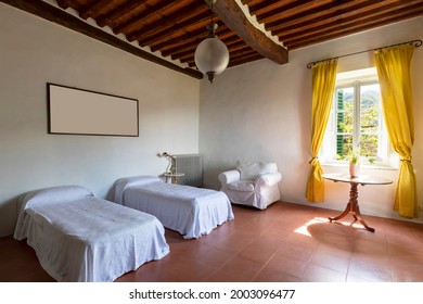 Interior Of A Bedroom With Two Single Beds. Spartan Ambiance And Nothing Luxurious. There Are No People Inside And The Floors Are Red And Beautiful.