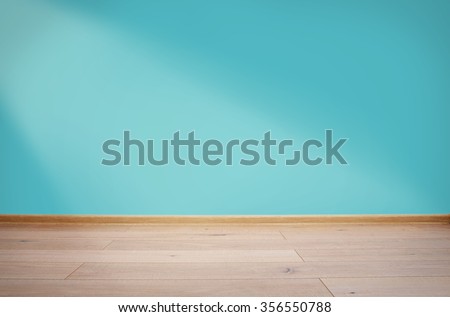 Interior with blue wall and wooden floor