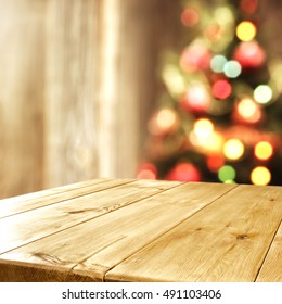 Interior With Blurred Xmas Tree And Wooden Old Table Place 