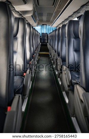 Interior of a bus with empty seats and seats in a row