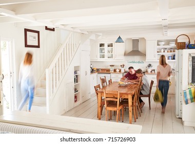 Interior Of Busy Family Home With Blurred Figures