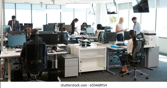 Interior Of Busy Modern Open Plan Office With Staff