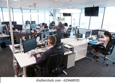 Interior Of Busy Modern Open Plan Office With Staff