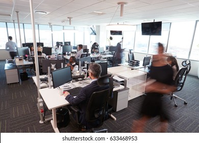 Interior Of Busy Modern Open Plan Office With Staff - Shutterstock ID 633468953