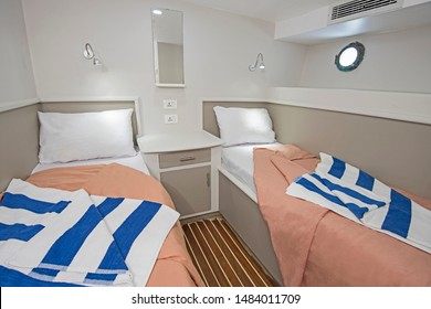 Interior Of Cabin Bedroom On Luxury Sailing Yacht With Twin Beds