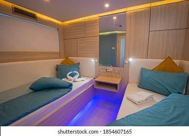 Interior Of Cabin Bedroom On Luxury Sailing Yacht With Twin Beds