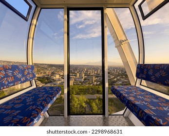 Interior of a cabin of ferris wheel in amusement luna park. Entertainment and fair concept. Inside of empty cabin
