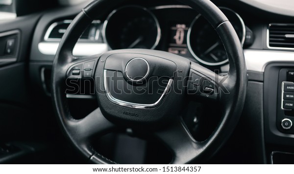 Interior car. Black\
steering wheel of the\
car.