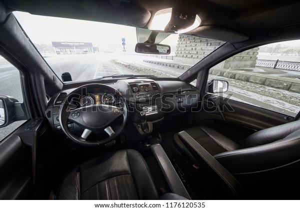 Interior of car\
cabin on road on winter day.\

