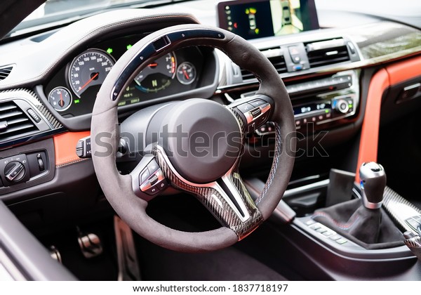 interior of car cabin, testing for sale, soft\
focus, focus only on steering\
wheel