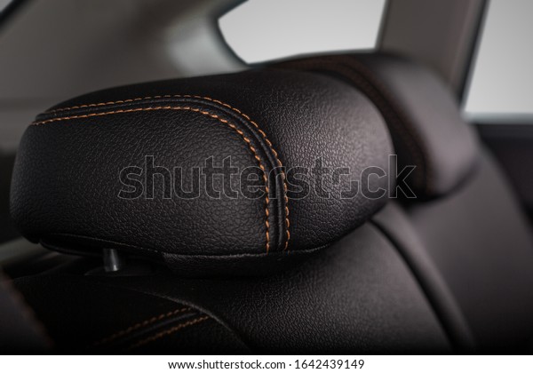 the interior of the car\
is covered with handmade genuine leather. the headrest of the rear\
bench seat