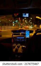 Interior Of A Car Driving Night Rainy City. Blurred City Lights. Kuala Lumpur, Malaysia - 03.14.2020