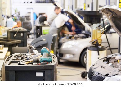 Interior of a car repair shop - Shutterstock ID 309497777