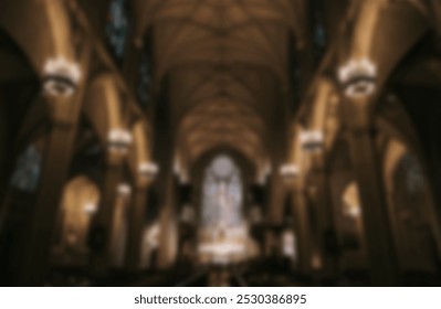 Interior of a catholic church, blurry background image. Blurry gothic or Christian church dark desktop background wallpaper. Christian church or cathedral religion interior background image. - Powered by Shutterstock