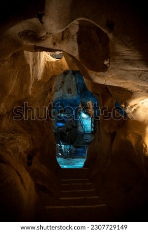 interior of a cave with bluish colours inside it
