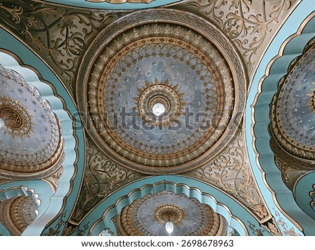 Interior ceiling of the Mysore Palace (Amba Vilas Palace) in Karnataka, India, showcasing the ornate and intricate Indo-Saracenic architectural style. The image highlights the detailed painting