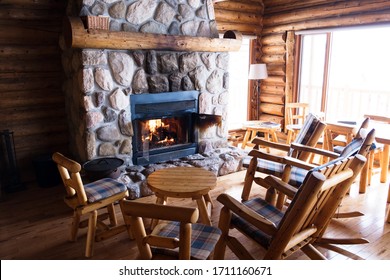Interior of a chalet with seats and fire. Nobody. Canada