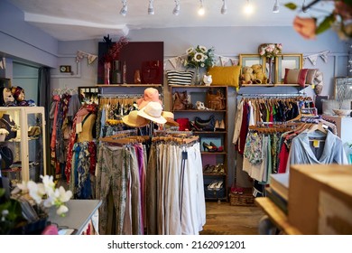 Interior Of Charity Shop Or Thrift Store Selling Used And Sustainable Clothing And Household Goods - Shutterstock ID 2162091201