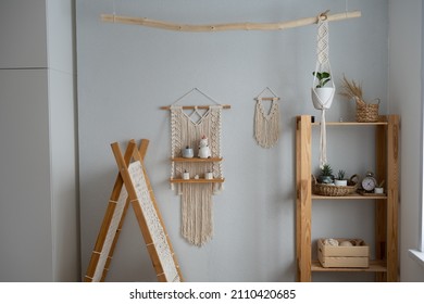 The Interior Of The Children's Room In Scandinavian Style. Beautiful Decoration Made Of Natural Materials, Wood And Macrame. Tent, Hinged Shelf And Shelving.