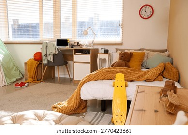 Interior of children's room with study table, bed and toys
