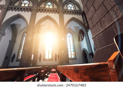 interior of Christian Catholic church with pews and sunlight. Cathedral of Sacred Heart of Jesus in Tashkent in Uzbekistan - Powered by Shutterstock