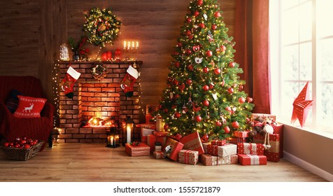 interior christmas. magic glowing tree, fireplace and gifts   - Powered by Shutterstock