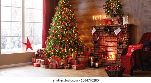 interior christmas. magic glowing tree, fireplace and gifts  