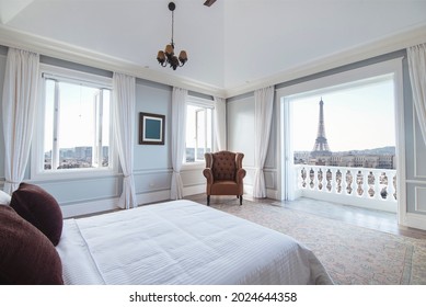 Interior of classic modern bedroom of a hotel or apartment condominium with beautiful views of Paris cityscape. - Shutterstock ID 2024644358