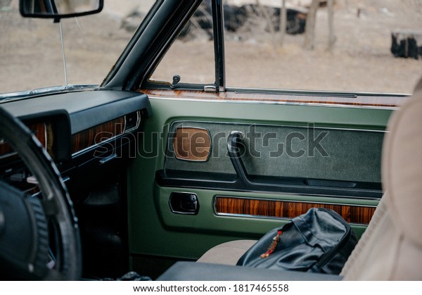 Interior of classic vintage car. luxury\
interior of a retro car.Close up view of front part of luxury old\
retro automobile.