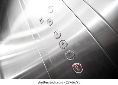 Interior and closeup of metal buttons in elevator
