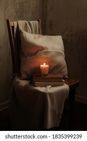 
interior composition with candles and a blanket