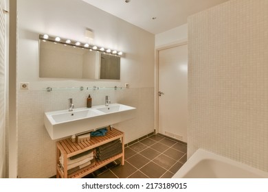 Interior Of Contemporary Bathroom With Shabby Beige Walls And Partitions And White Door At Home