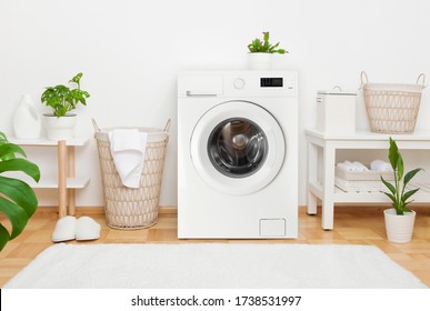 Interior of cosy laundry room with washing machine and carpet - Shutterstock ID 1738531997