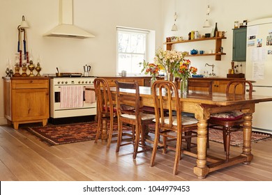 Interior Of The Country Style Kitchen And Dining Table In A Large Residential Home