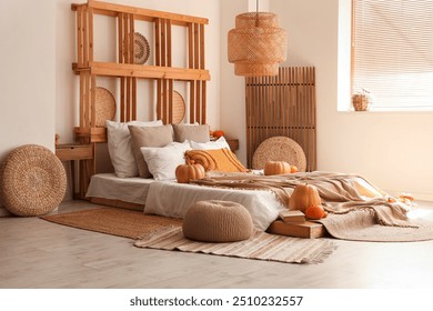 Interior of cozy bedroom with autumn decor and poufs - Powered by Shutterstock