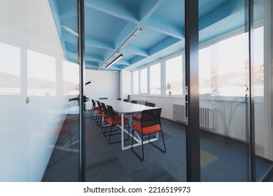 Interior Of Cozy Light Boardroom With Table, Modern Stylish Chairs And Desktop Computer, All Ready For Corporate Meeting. Empty Spacious Office Of Business Company Or Creative Coworking Space. 