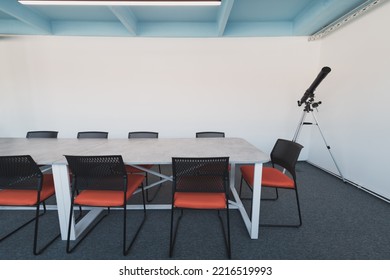 Interior Of Cozy Light Boardroom With Table, Modern Stylish Chairs And Desktop Computer, All Ready For Corporate Meeting. Empty Spacious Office Of Business Company Or Creative Coworking Space. 