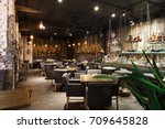 Interior of cozy restaurant. Contemporary design in loft style, modern dining place and bar counter, copy space